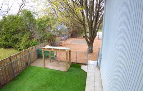 Turf grass and cabana for commercial sandbox daycare playground landscaping