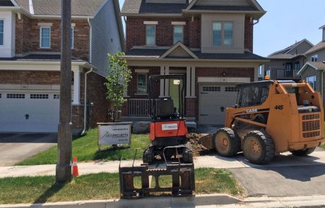 Excavating landscaping new front yard with skid steer and excavator