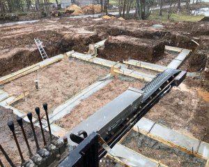 Stone slinger backfilling excvation for foundation with 3/4" stone
