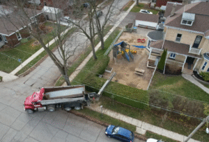 Stone Slinger truck delivery aggregate service Excavating Arkell ponds and grading retaining wall land clearing tree removal contractor